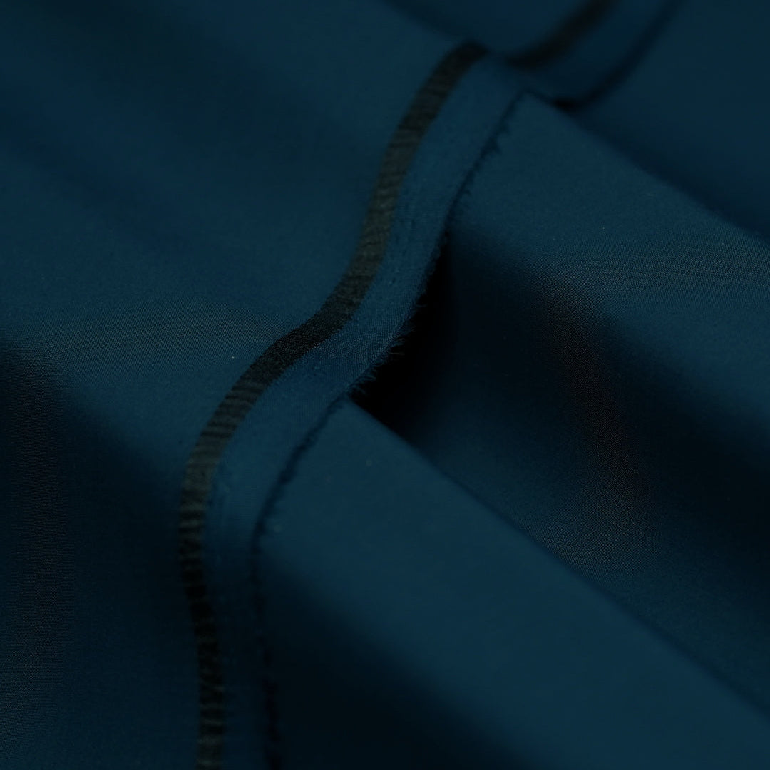 Close-up of a blue fabric texture with a zipper