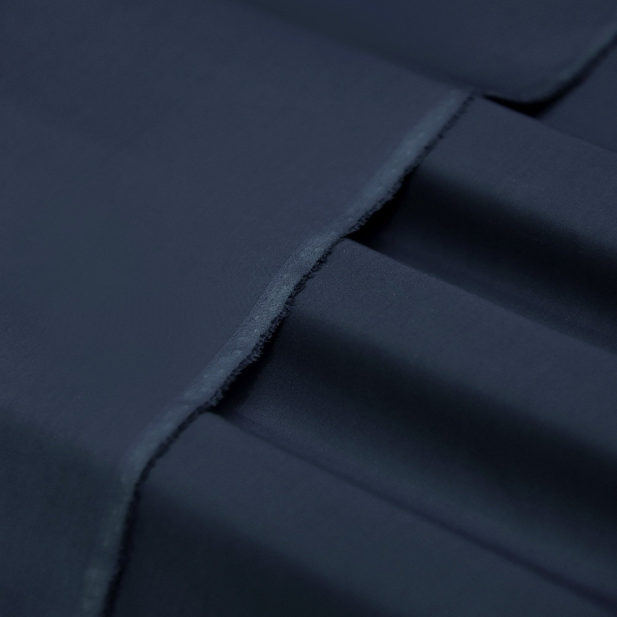 Close-up of dark blue fabric with folds
