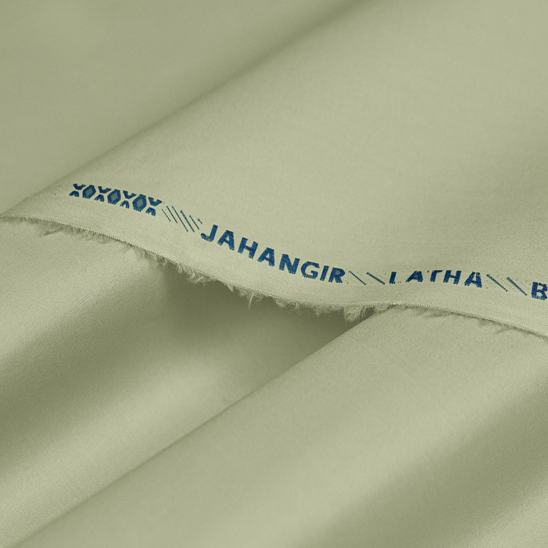 Close-up of green fabric with 'JAHANGIR LATHA' branding.