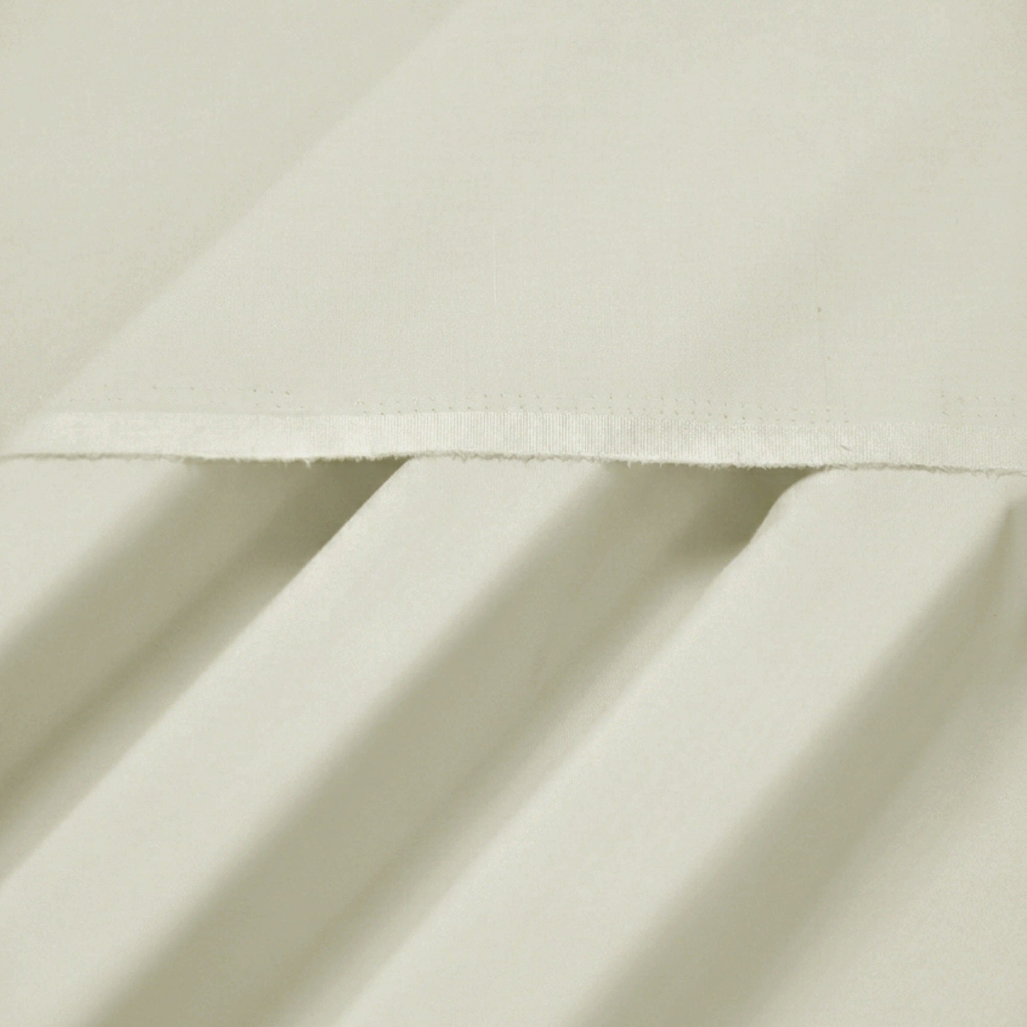 Close-up of beige fabric with folds