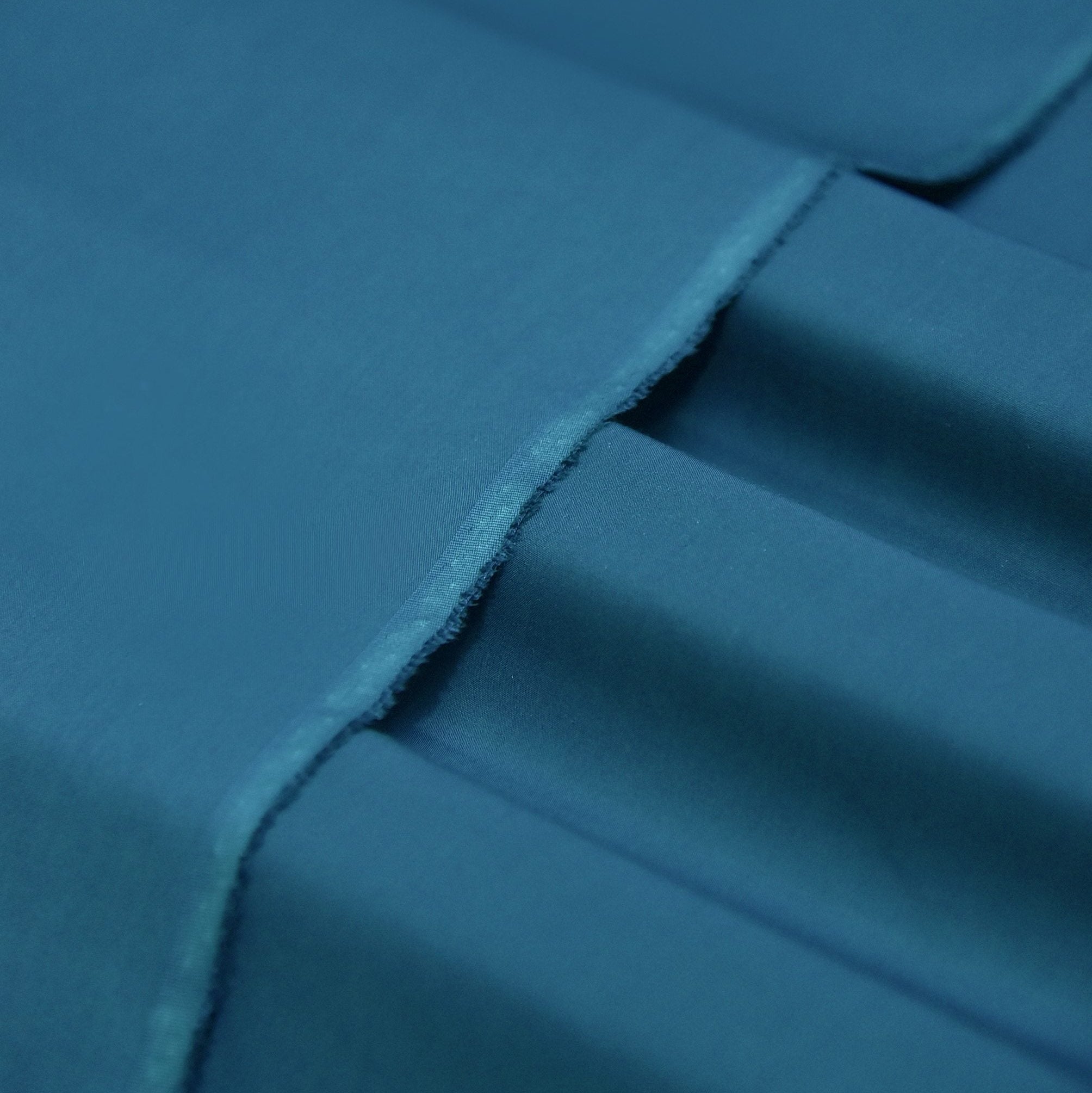 Close-up of blue fabric with folds