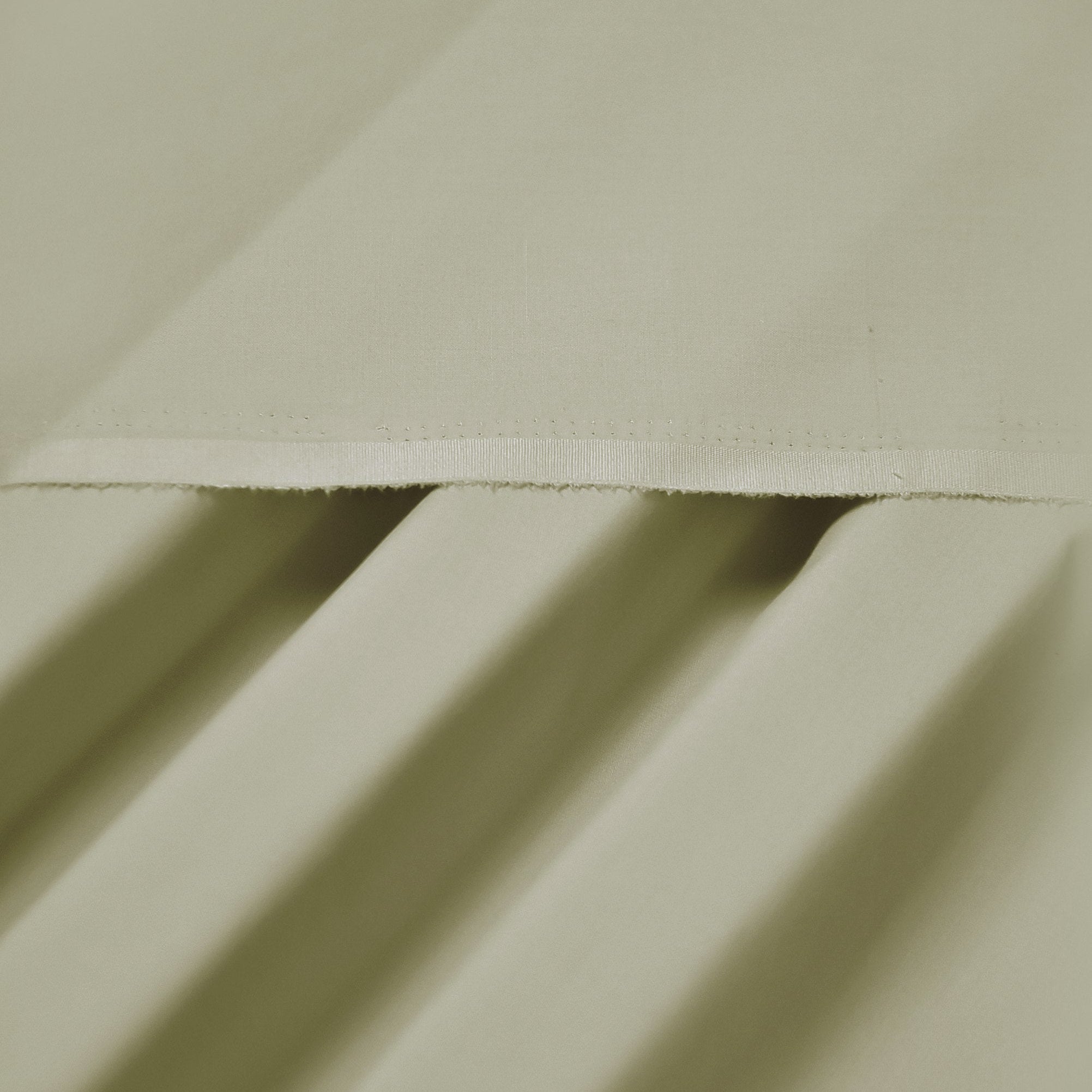 Close-up of beige fabric with folds