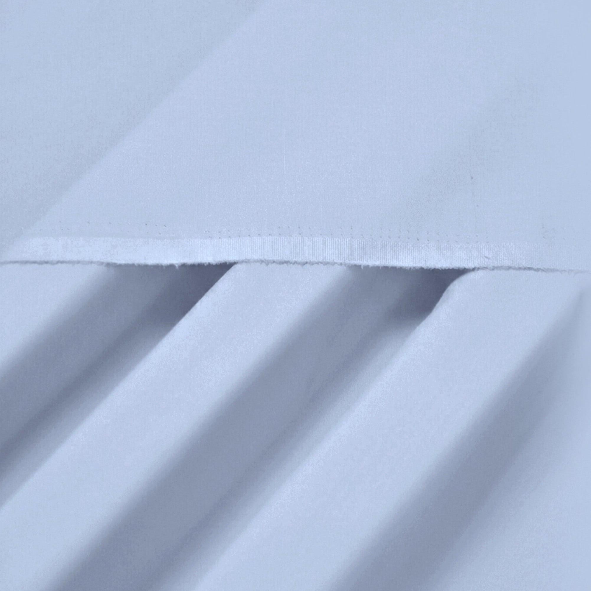 Close-up of light blue fabric with folds