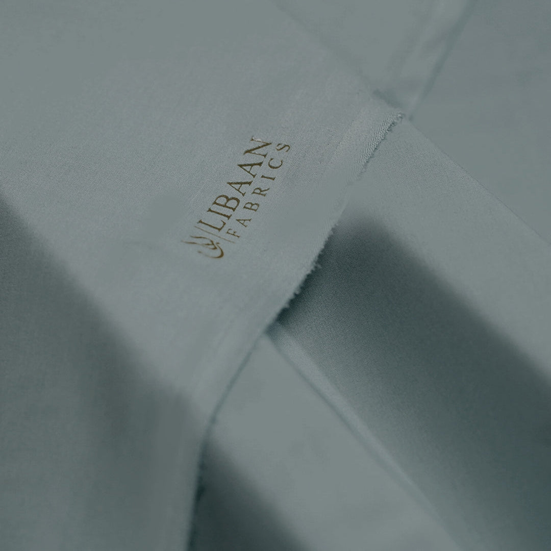 Close-up of Libaah Fabrics logo on a fabric texture