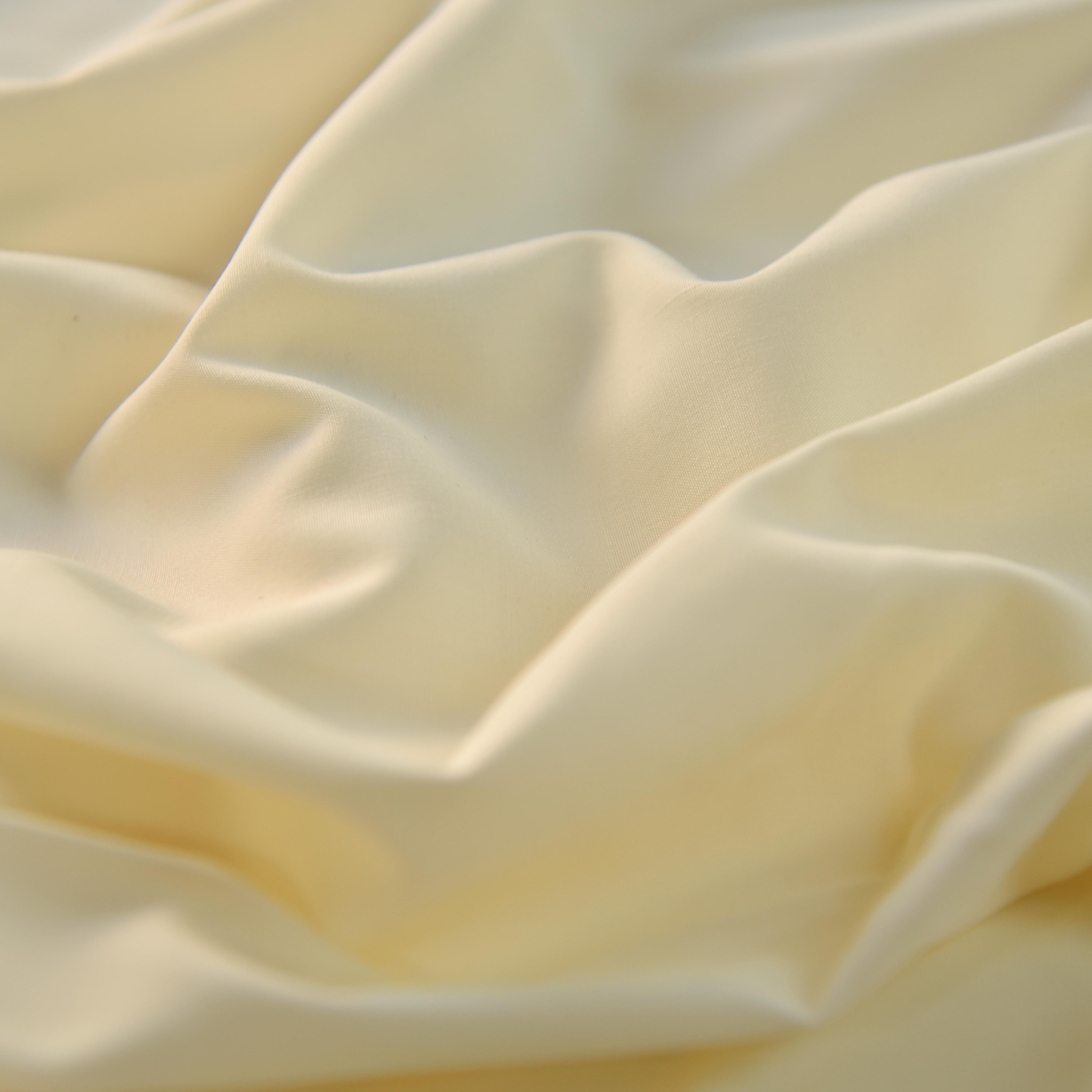 Close-up of beige fabric with folds