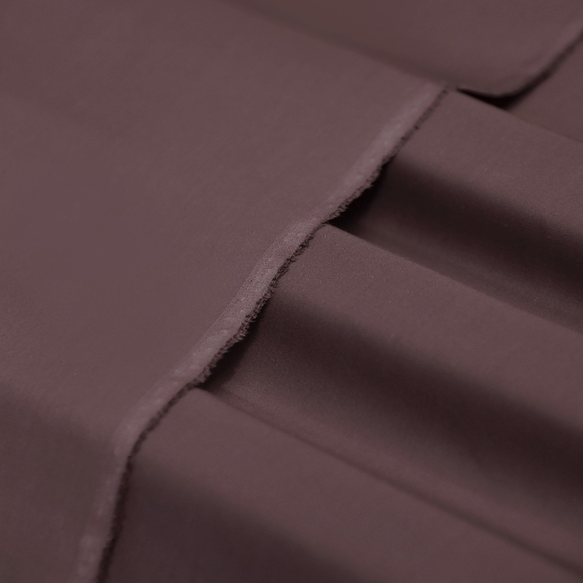 Close-up of brown fabric with folds