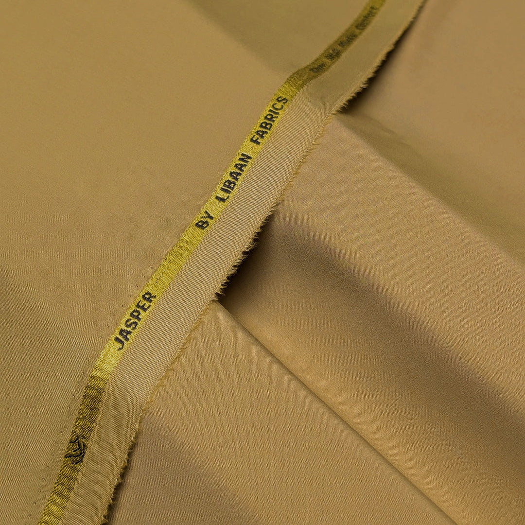 Beige fabric with a yellow thread label on a beige background