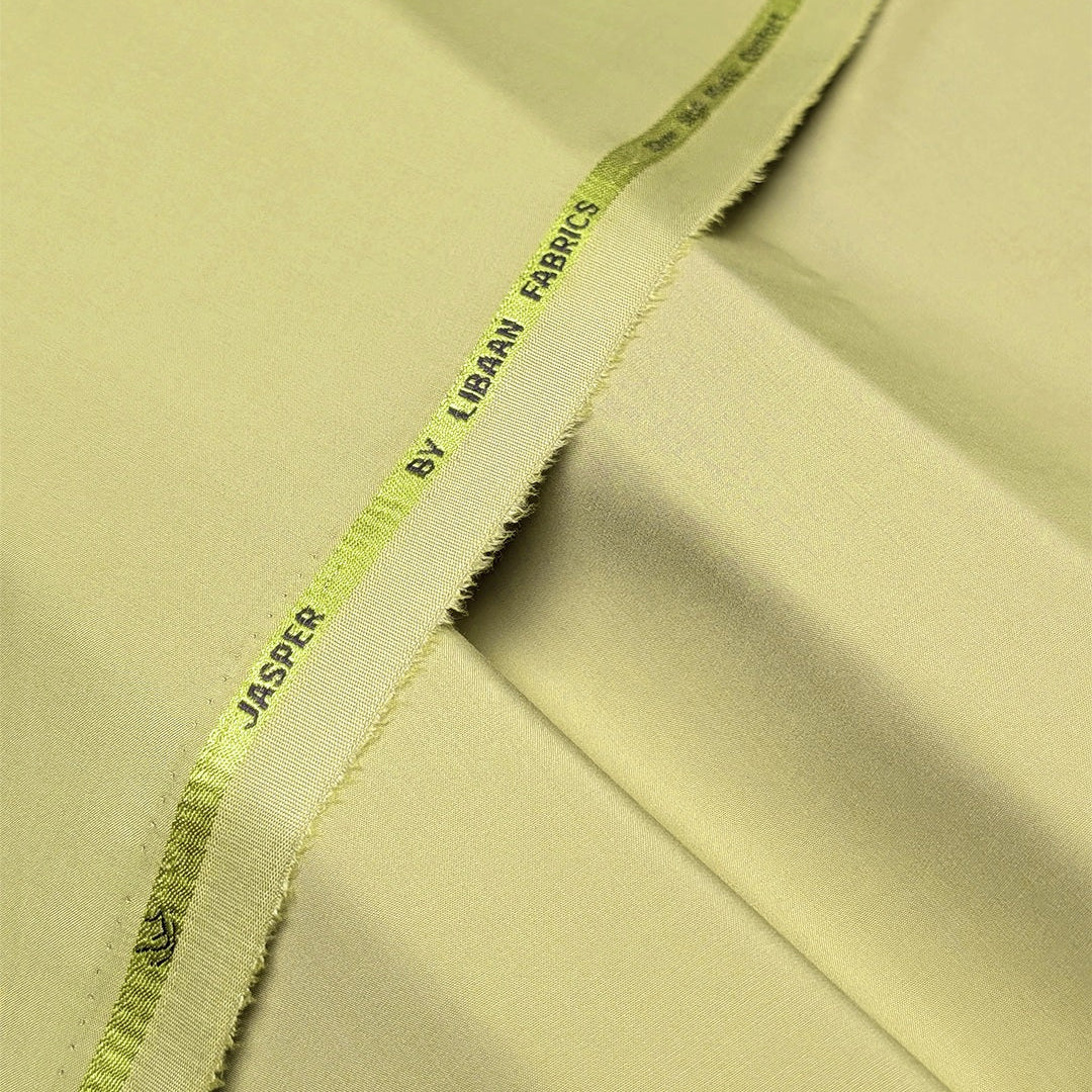 Close-up of light green fabric with 'Jasper' and 'Liban Fabrics' branding.