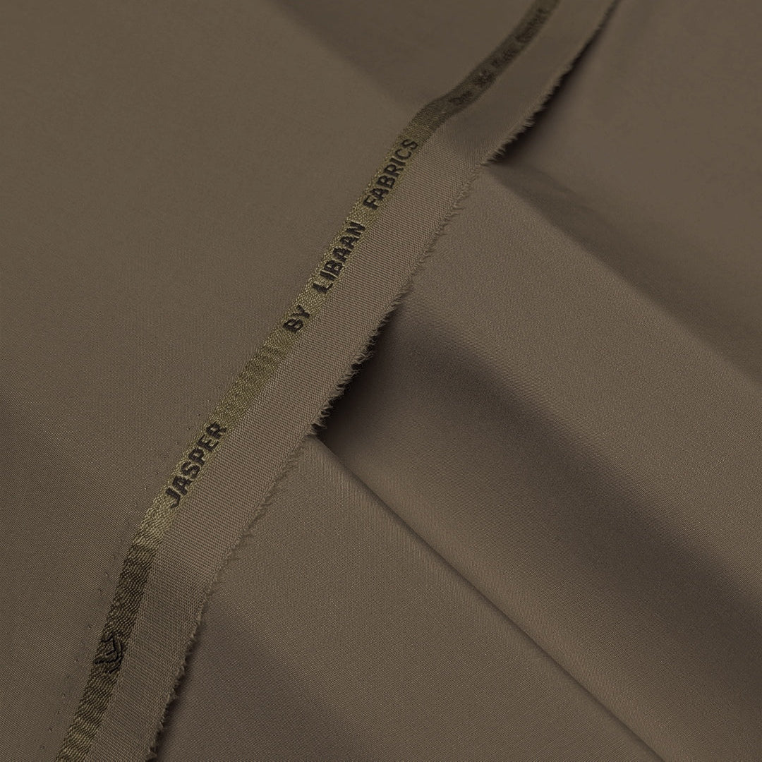 Close-up of beige fabric with 'Jasper by Libby' label.