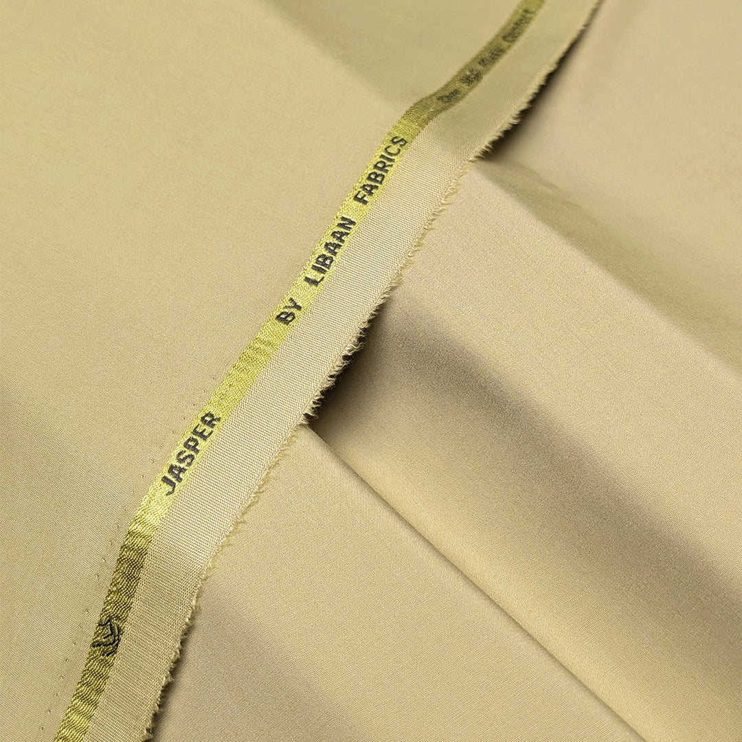 Close-up of beige fabric with a visible brand label.